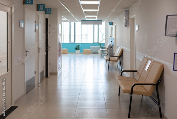 Fototapeta Empty corridor of hospitals, clinics, office rent. Sofas for seating and waiting area. Nobody