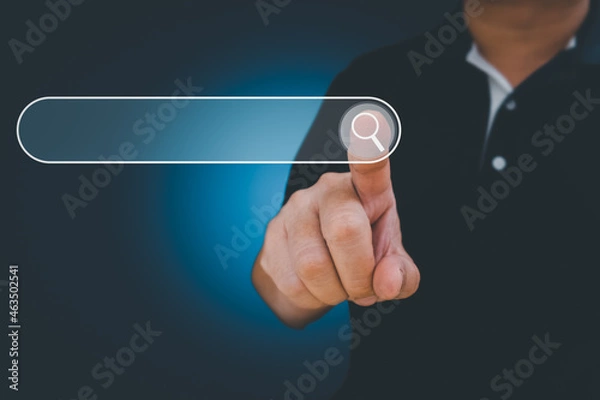 Obraz Man point on searching for data Information networking Concept, Business man clicking internet search page touch screen,copy space. data search technology search engine optimization.