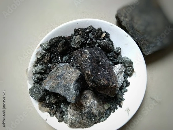 Fototapeta Shilajit is a sticky substance found primarily in the rocks of the Himalayas. It develops over centuries from the slow decomposition of plants. Shilajit is commonly used in ayurvedic medicine.  