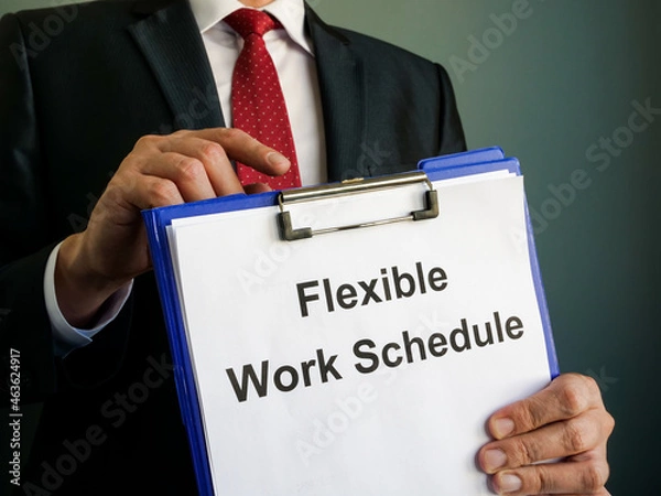 Fototapeta A manager shows Flexible Work Schedule in clipboard.