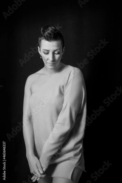 Fototapeta Black and white portrait of a beautiful woman with a short haircut mohawk emotions mood
