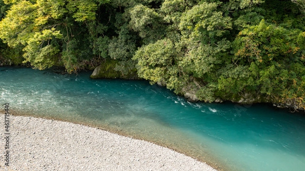Obraz A turquoise river flowing through the mountains