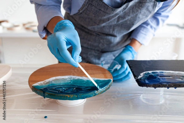 Fototapeta the process of making the sea on a two-component resin board, master class on resin art