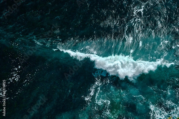 Obraz Aerial view to seething waves with foam. Waves of the sea meet each other during high tide and low tide