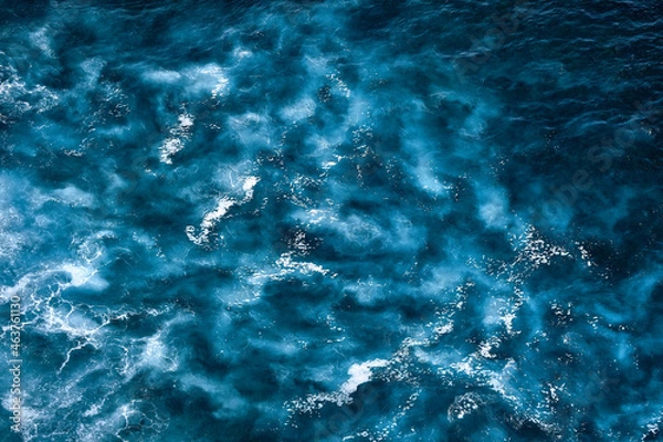 Fototapeta Aerial view to seething waves with foam. Waves of the sea meet each other during high tide and low tide