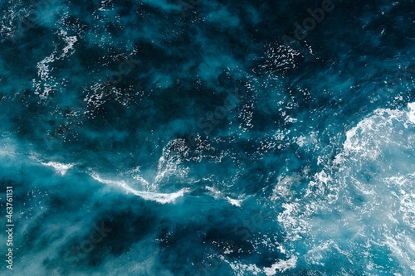 Obraz Aerial view to seething waves with foam. Waves of the sea meet each other during high tide and low tide