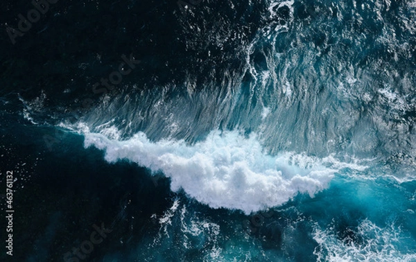 Obraz Aerial view to seething waves with foam. Waves of the sea meet each other during high tide and low tide