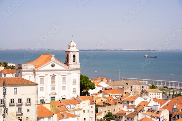 Fototapeta Views of a downtown with an ancient monastery with the river on the background