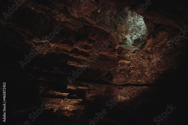 Fototapeta Dark, colorfulTextures of the walls in a lava tube of Canaria island
