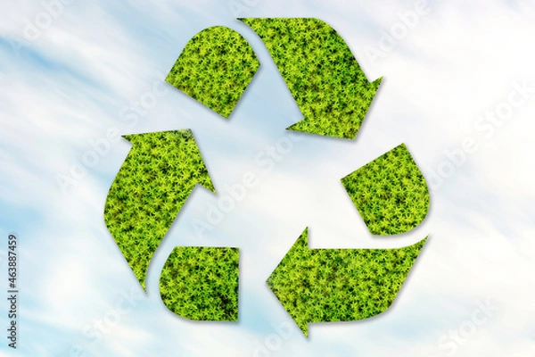 Fototapeta Recycling icon mocked up of grasses on foreground. Symbol of zero waste concept.