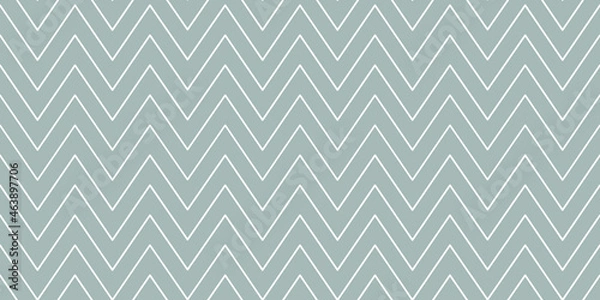 Fototapeta Christmas chevron pattern. Abstract background with white zig-zag stripes on a grey background. Vector illustration