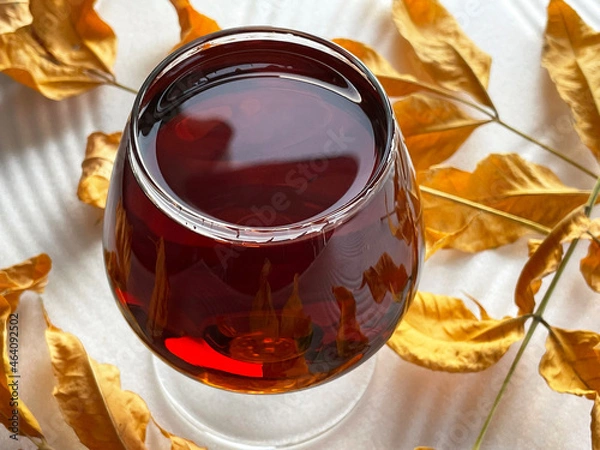 Obraz overflowing glass of brandy whiskey cognac autumn booze
