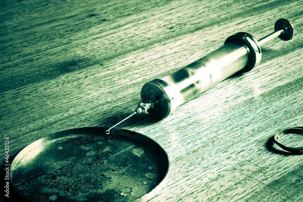 Obraz old glass syringe