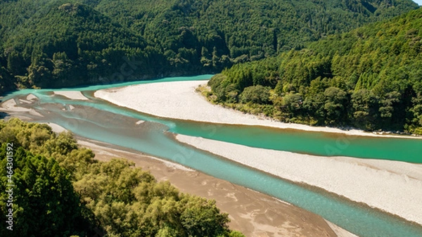 Obraz Jade-colored river flowing between the mountains