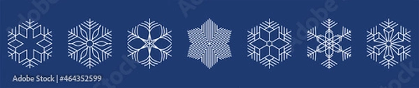 Obraz white snowflakes on dark blue background.