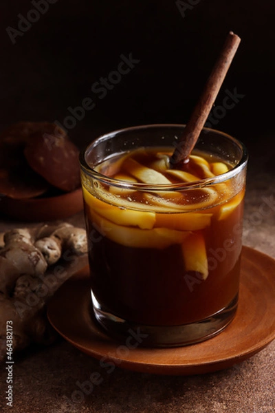 Fototapeta Wedang Bandrek kelapa muda is a traditional drink from West Java, Indonesia, made from ginger, brown sugar, spices and young coconuts. 