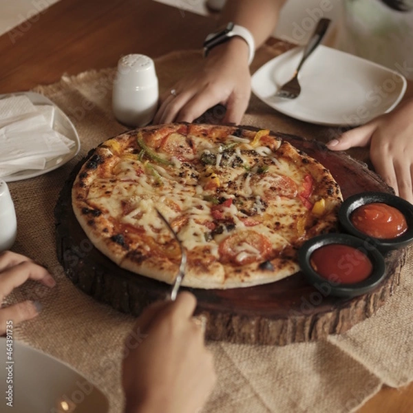 Obraz person holding pizza