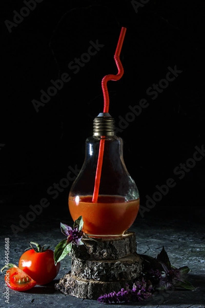 Fototapeta Tomato juice in a glass, cocktail on a wooden stand, simple composition, rustic style