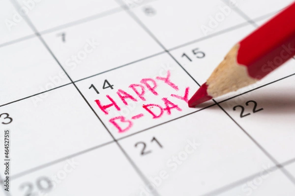 Fototapeta Person marks the date on the calendar as a birthday reminder