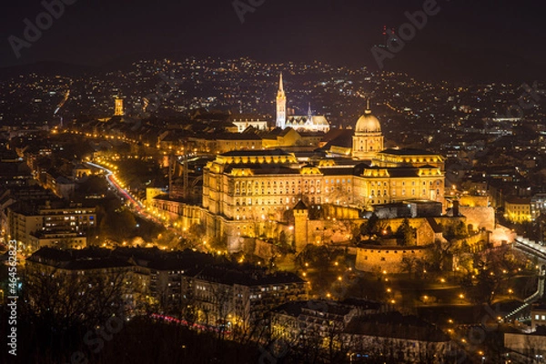 Fototapeta Historic Royal Palace - Buda Castle or Budai Vár close up evening view with lights on from Buda Hills, Citadella in Budapest, Hungary