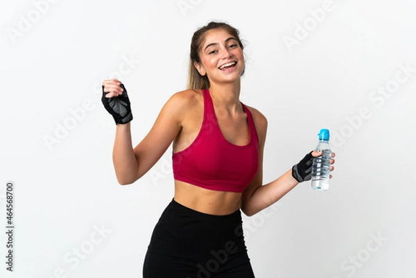 Obraz Young caucasian woman isolated on white background with sports water bottle