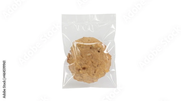 Fototapeta Homemade cookie in plastic bag package isolated on white.