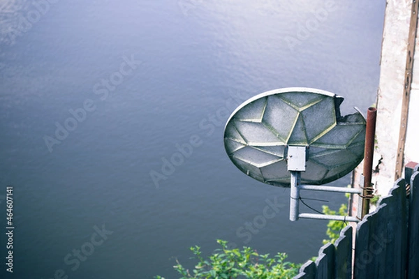 Obraz Satellite dish over river 