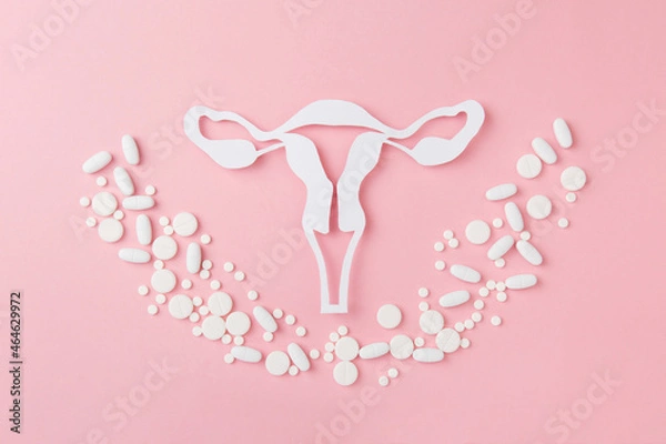 Fototapeta Concept of Gynecology therapy, woman health, place for text. Vaginal suppositoriy, tablets on pink background. Treatment of vaginal infections from candidiasis, thrush, sexually transmitted infections