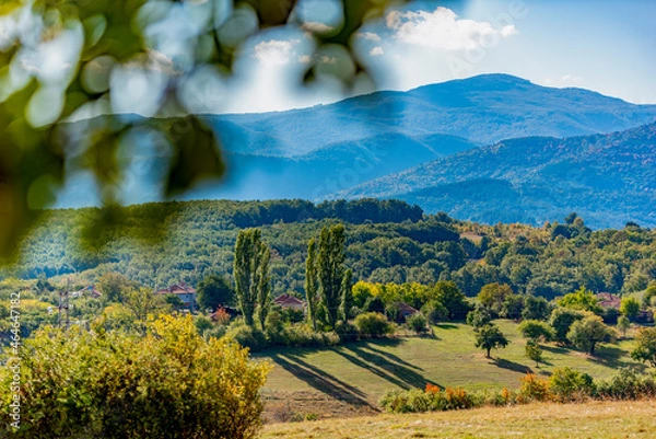 Fototapeta Colorful autumn mountain scenery with long afternoon shadows