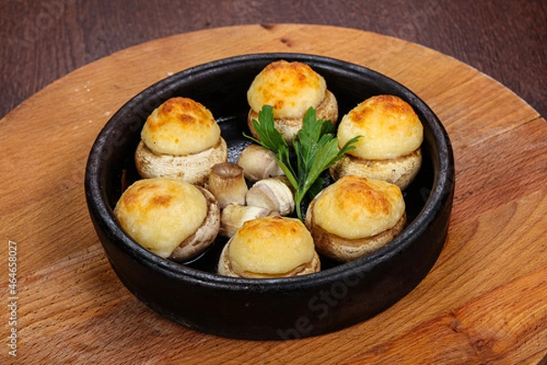 Fototapeta Baked champignon staffed with cheese
