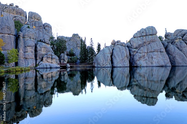 Obraz Sylvan Lake's Rocks, Trees, and Bridge Are Reflecting On The Water