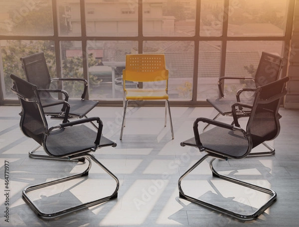Fototapeta Meeting room with black chairs put in a circle prepared for office workers for brainstorming meetings. Empty chair there was no officer sitting in the meeting yet.