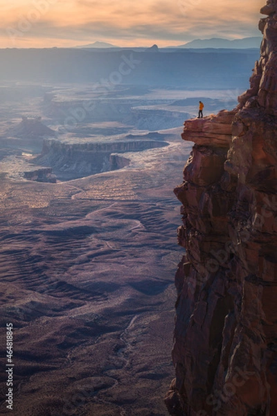 Fototapeta A man stand alone at a cliff looking canyon view, Canyonlands National Park