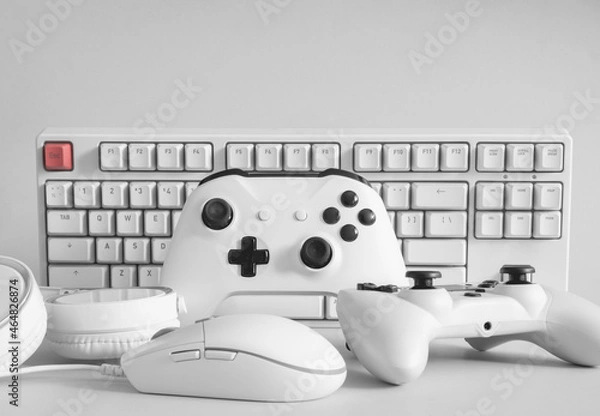 Fototapeta gamer work space concept with gaming gear, mouse, keyboard, joystick, and headset