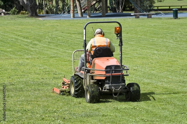 Obraz Man on Ride-On mower cutting grass