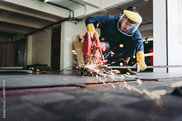 Fototapeta Craftsman Welding is Cutting Steel Work in Fabrication Workshop, Welder Man in Safety Protective Equipments Doing Metalwork in Construction Site. Steel Labor Skill and Workshops Production Concept