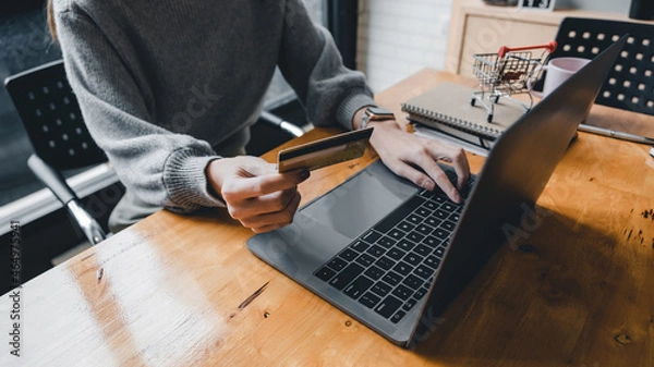 Obraz Close up young asian woman holding credit card and using tablet computer. Businesswoman working at home. Online shopping, e-commerce, internet banking, spending money, working from home concept