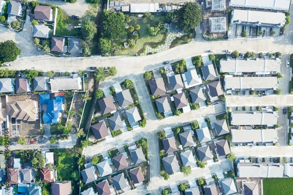 Fototapeta Housing estate in aerial view. That village or community consist of residential building in land lot. Real estate or property from development by construction for owned, sale, mortgage and investment.
