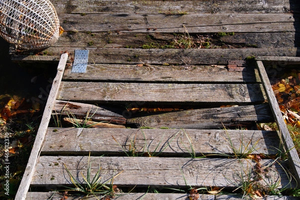 Obraz Rotten pontoon with broken timber. Safety on water. Dangerous water.