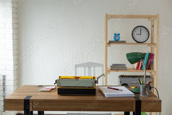 Fototapeta Vintage old typewriter at wooden desk table. Writer or screenwriter concept