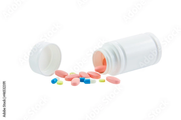 Obraz Spilled container of medicines isolated on white