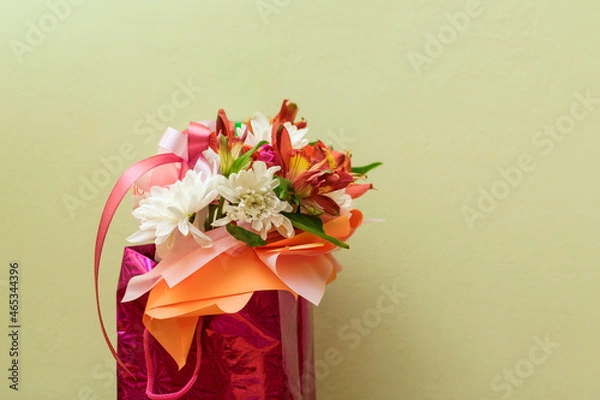 Fototapeta A small bouquet of flowers in a festive package.