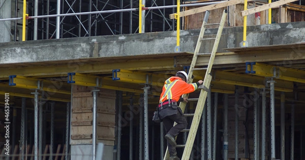 Obraz worker in ladder construction site metal and concrete structure hard hat professional