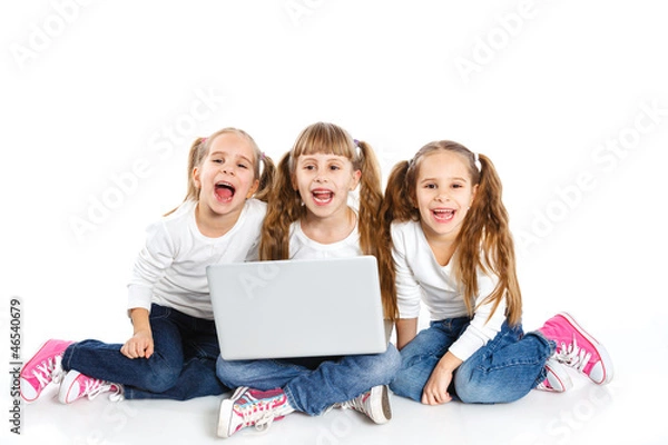 Fototapeta Three attractive girl using a laptop