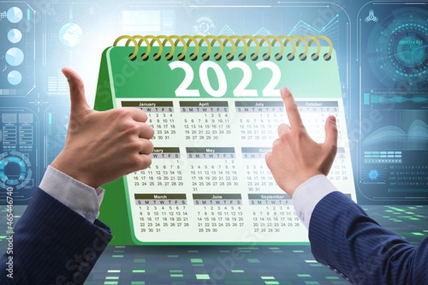 Fototapeta Businessman in the calendar concept of year 2022