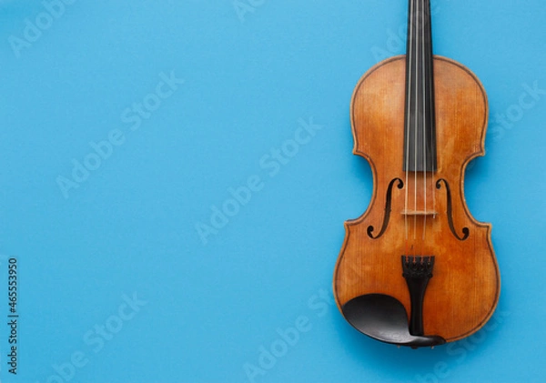 Fototapeta Classical music concert poster with brown color violin on blue background with copy space for your text
