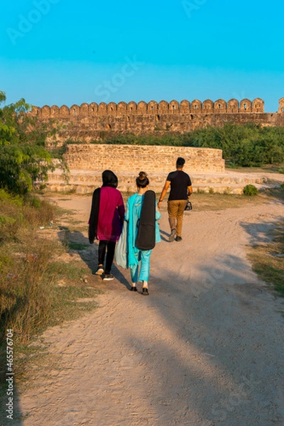 Obraz Three people walking in Rohtas Fort towards the well