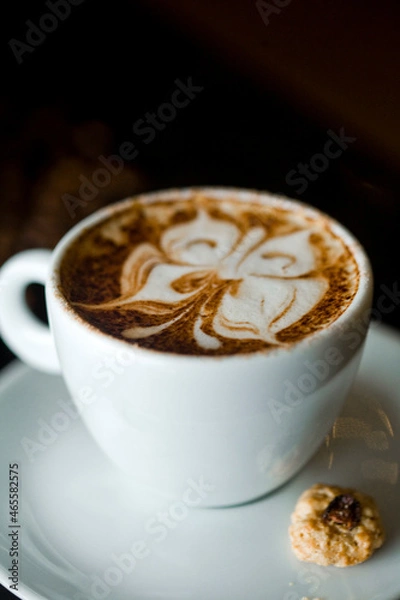 Fototapeta Coffee cup and coffee beans at a coffee shop. Still details. High quality photo
