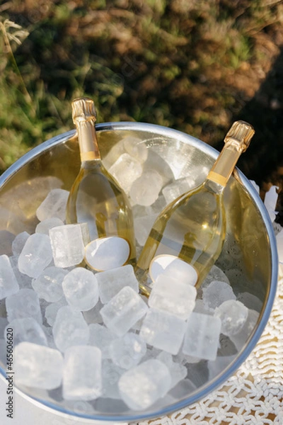Obraz Champagne bottles with ice, white sparkling wine. White wine.