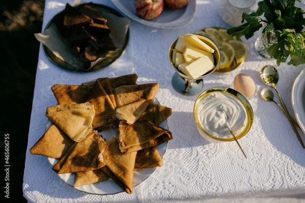 Obraz Pancakes in a breakfast plate. Laid breakfast table. Pancake butter